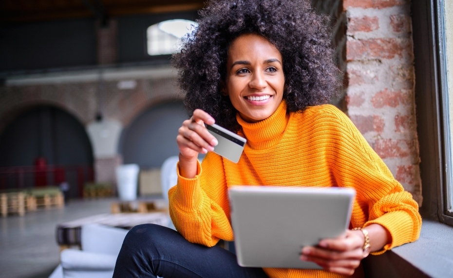 Woman business owner with computer and credit card