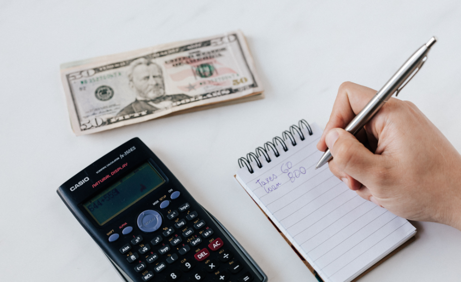 Man using calculator to total financial assets