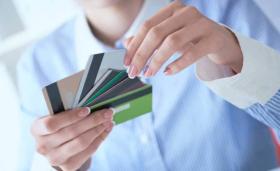 woman choosing plastic card
