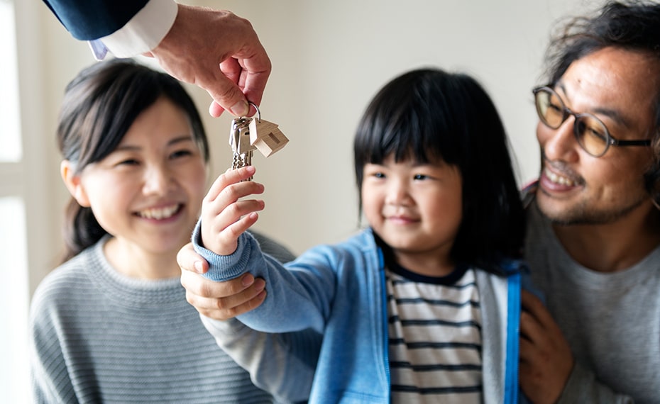 young family with new house keys
