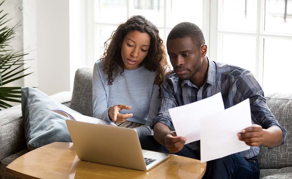 couple looking at bank statements